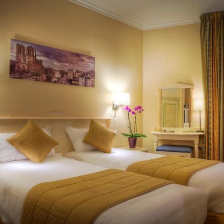 Hotel Louvre Sainte Anne Париж Стая снимка
